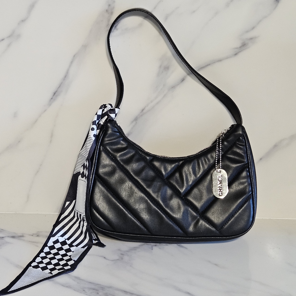 Black Quilted Leather Shoulder Bag With Faux Charm And Scarf Accent